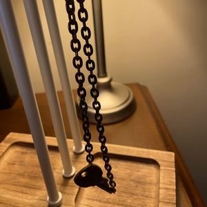 Tribe Kelley original key necklace. Says “tribe”